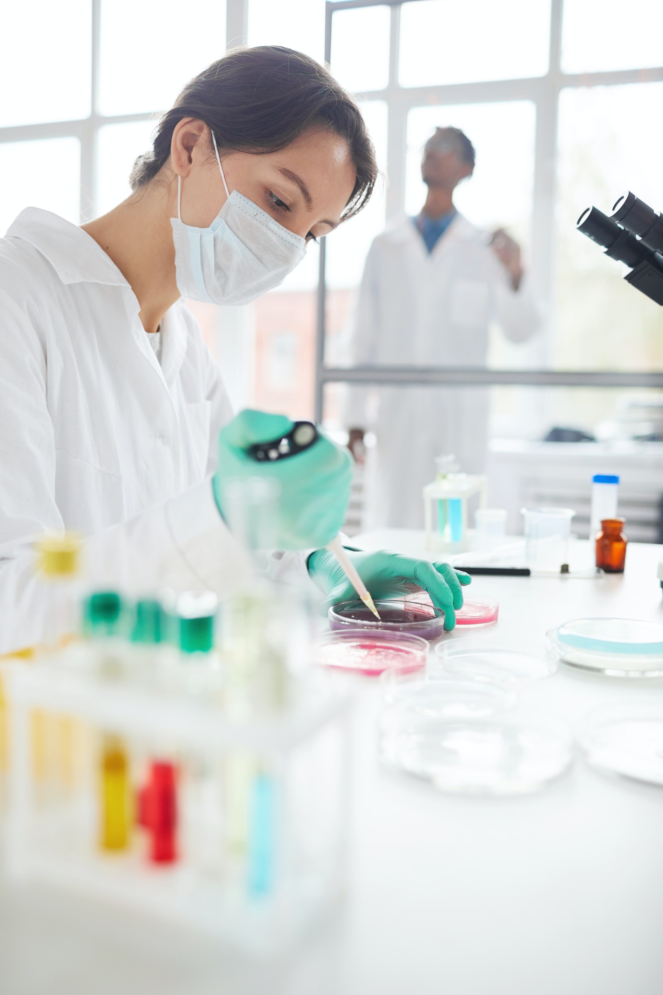 A doctor of Syncretic Research Solutions conducting a research in a Laboratory